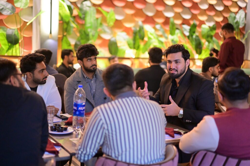 Founders in conversation around a table