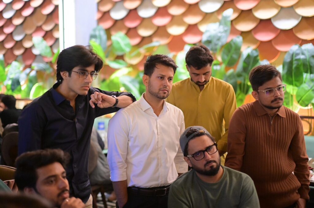 A group of founders talking between sessions