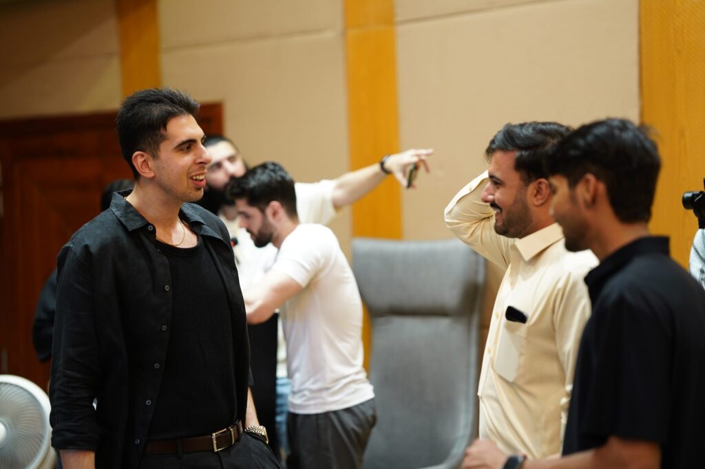 Attendees networking near the stage