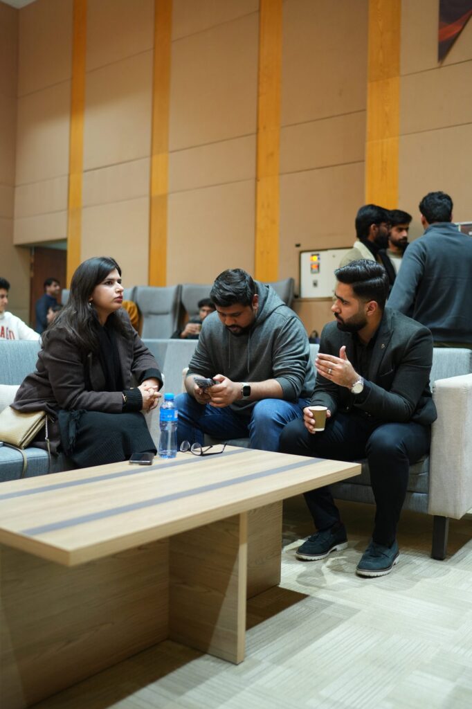 Attendees talking in the lounge seating