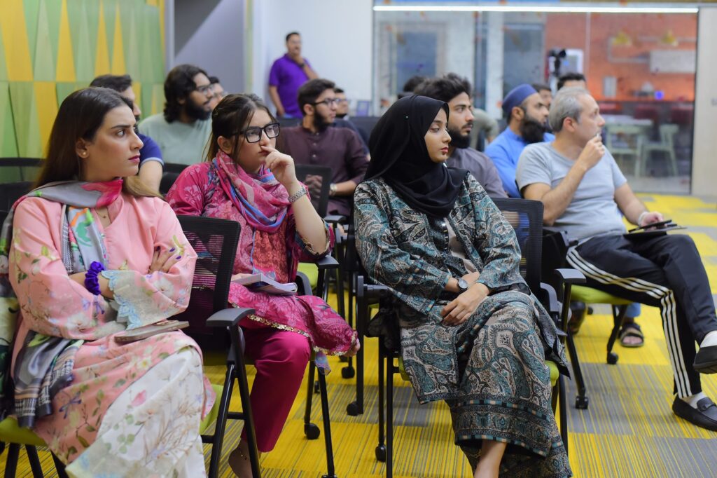 Attendees listening from the front rows