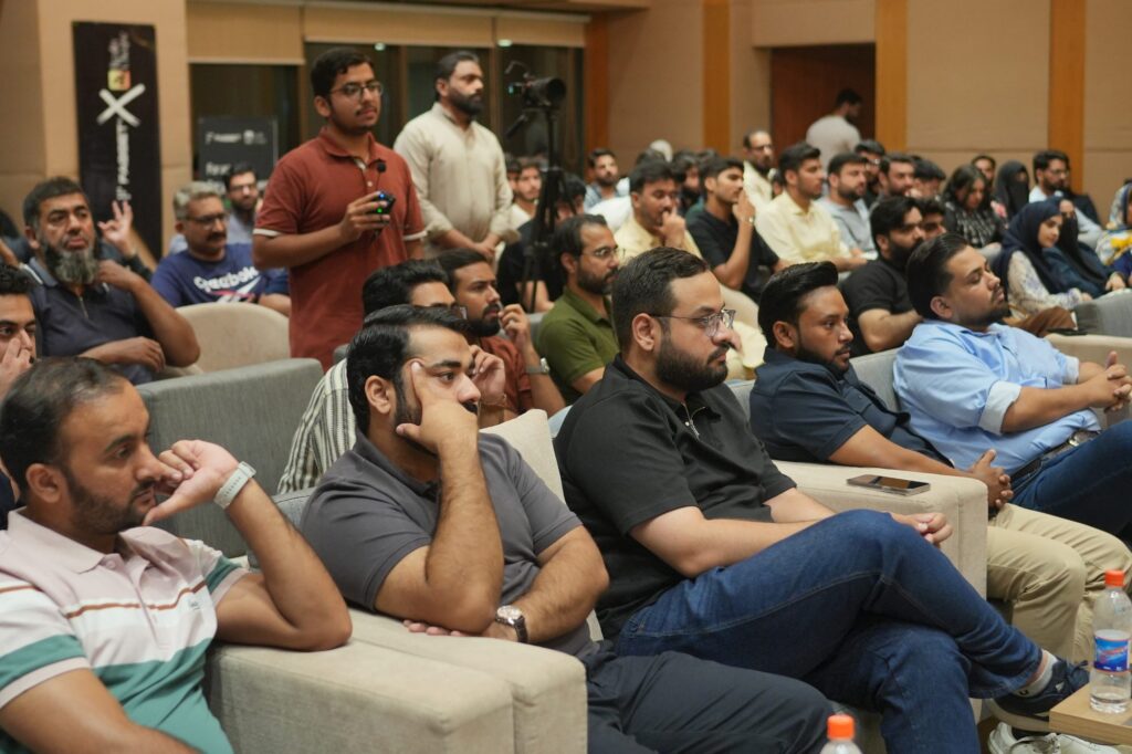 Attendees listening from the lounge seating