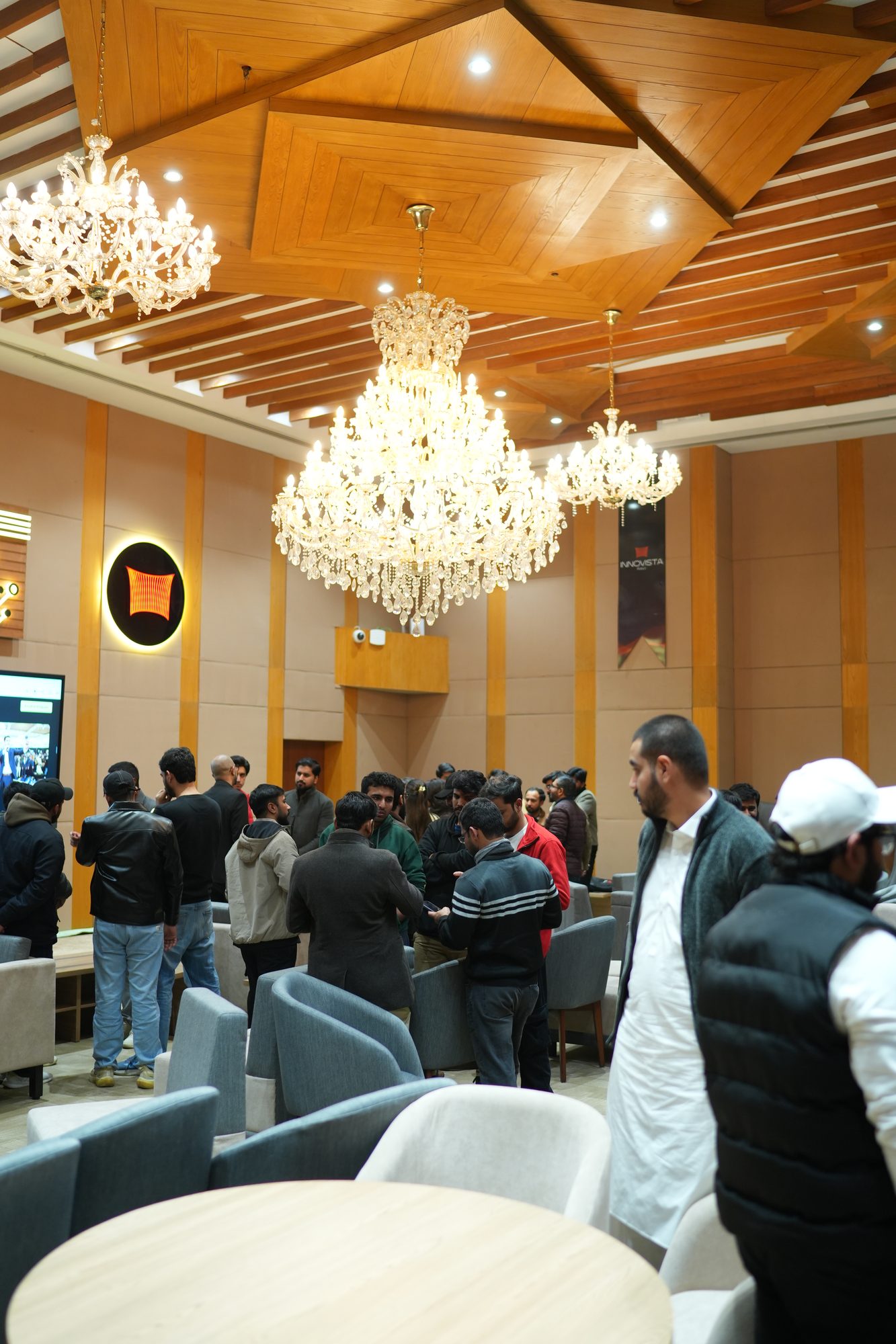 Attendees networking in the Lahore hall