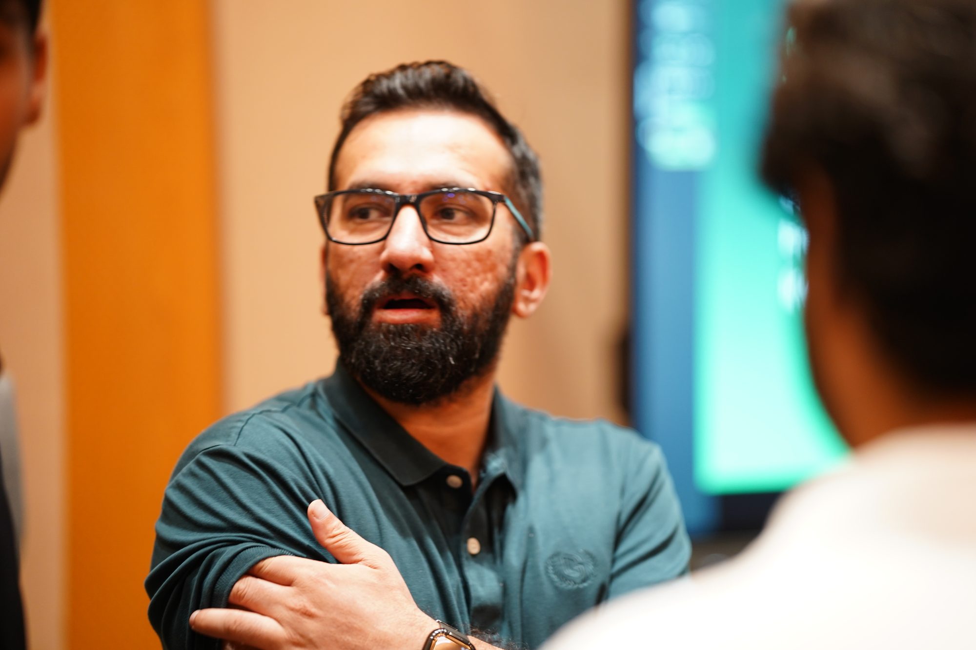 An attendee mid-conversation after the sessions