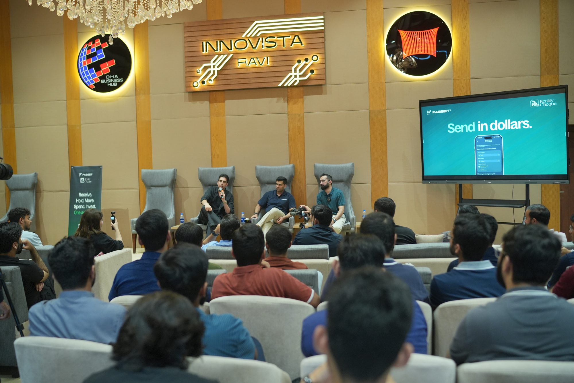 The Lahore audience seated facing the screen